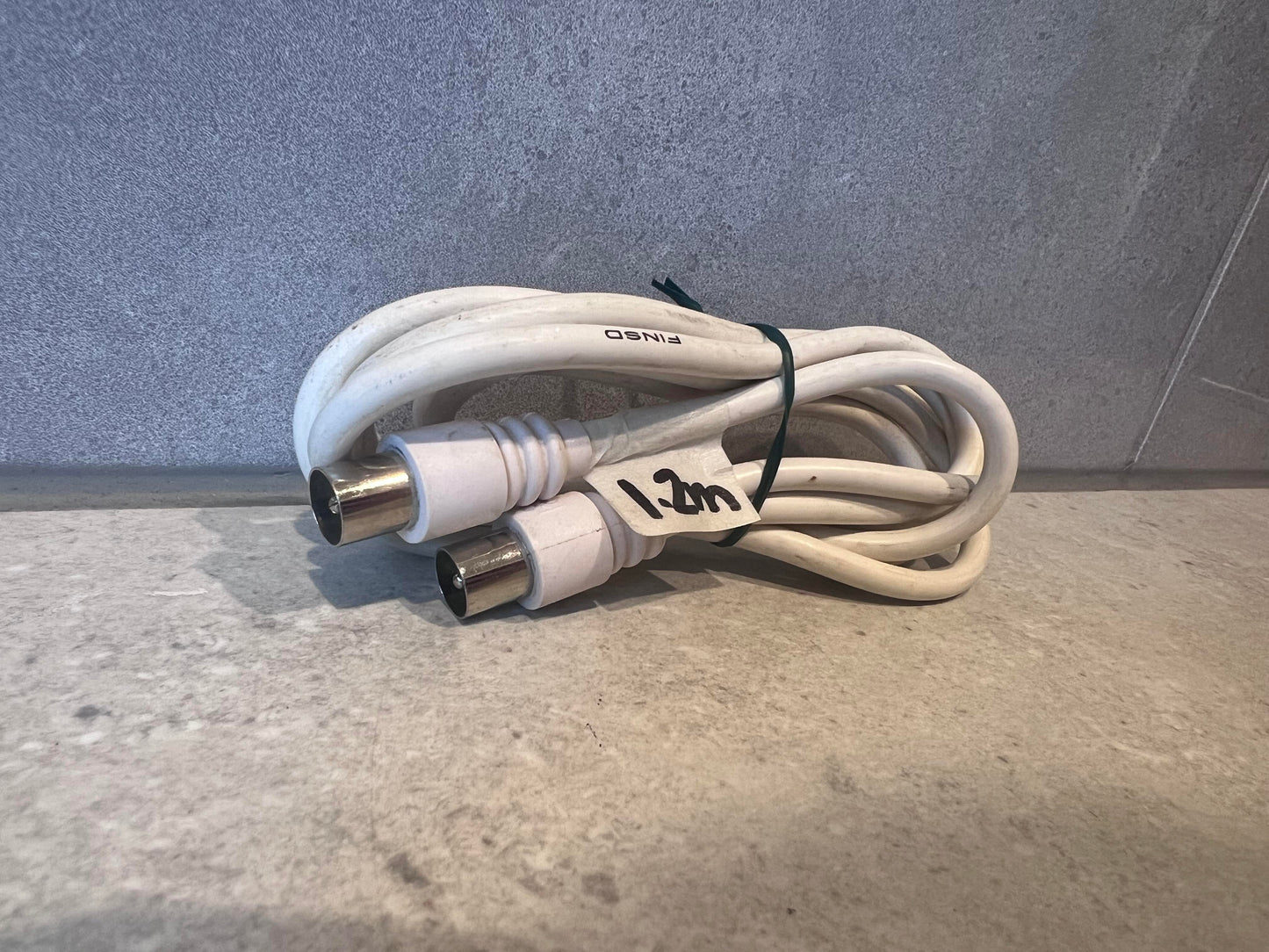 White coaxial RF antenna cable with metal connectors, coiled and labeled 1.2m