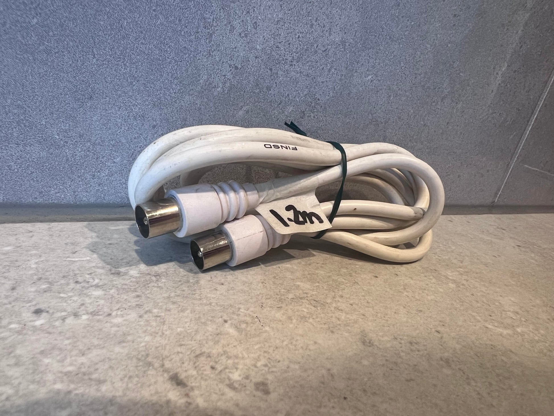White coaxial RF antenna cable with metal connectors, coiled and labeled 1.2m