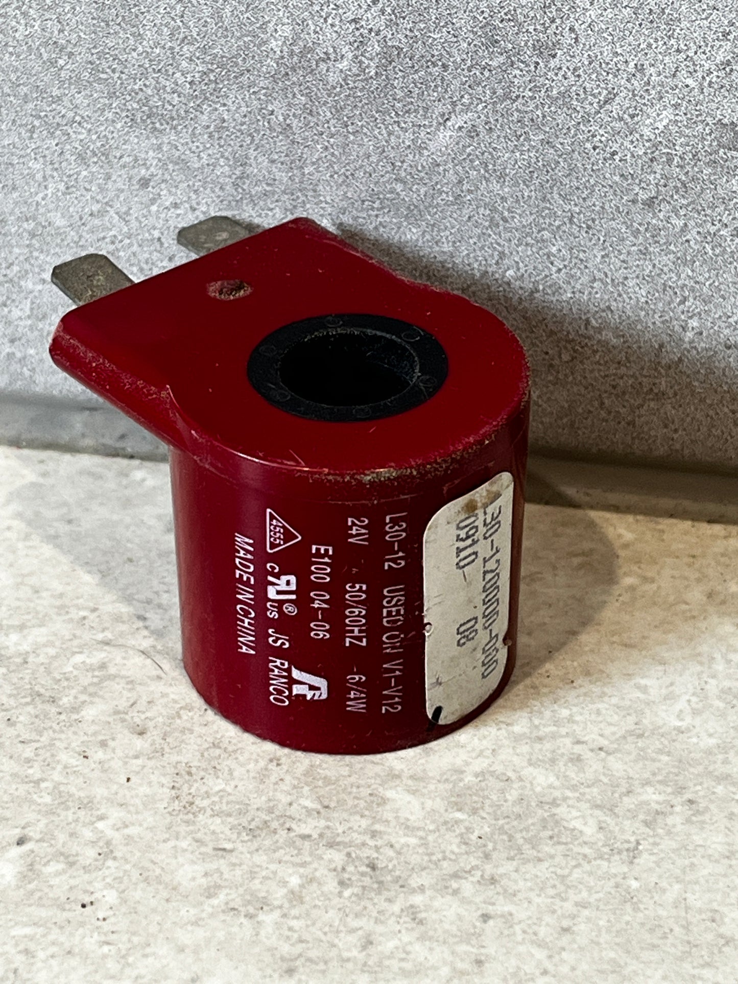 Ranco L30-12 solenoid coil 24V electrical component on stone surface