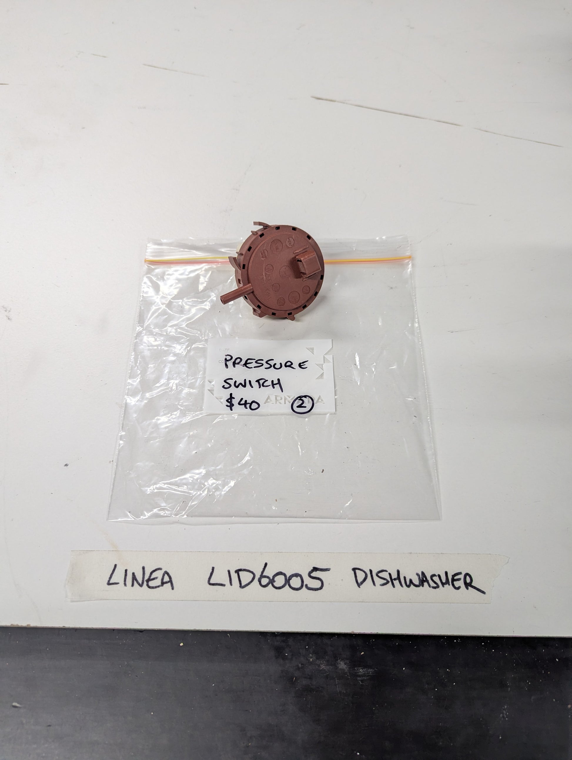 Linea LID6005 dishwasher pressure switch on plastic bag with label