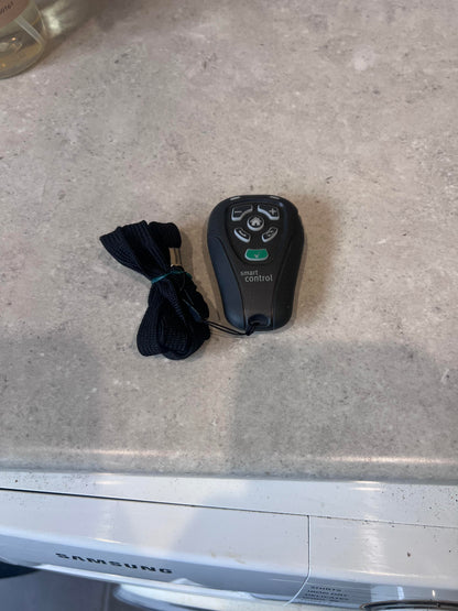 Unitron Smart Control Remote with lanyard, front view showing buttons