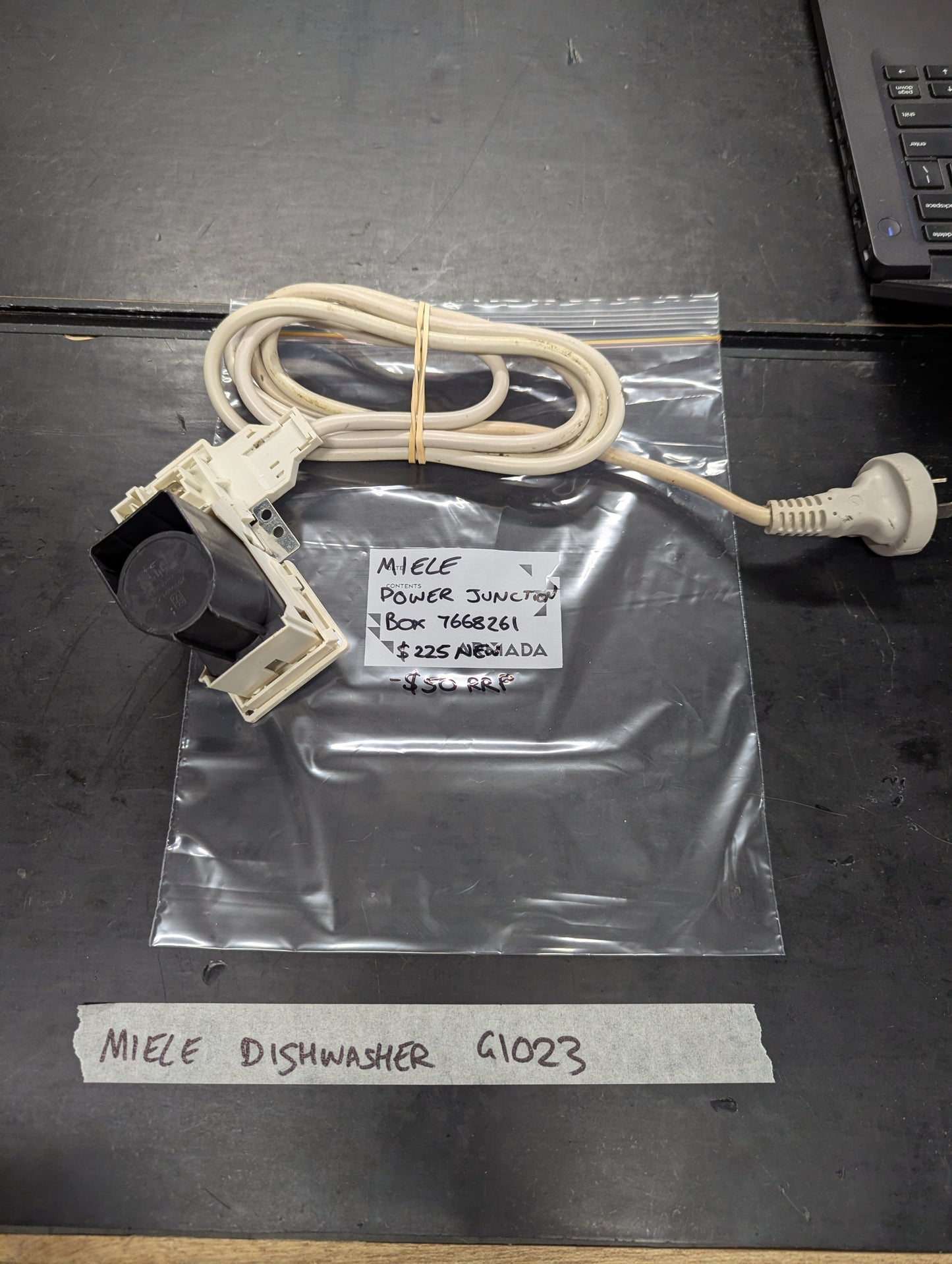Miele dishwasher G1023 power junction box with attached cord on tabletop