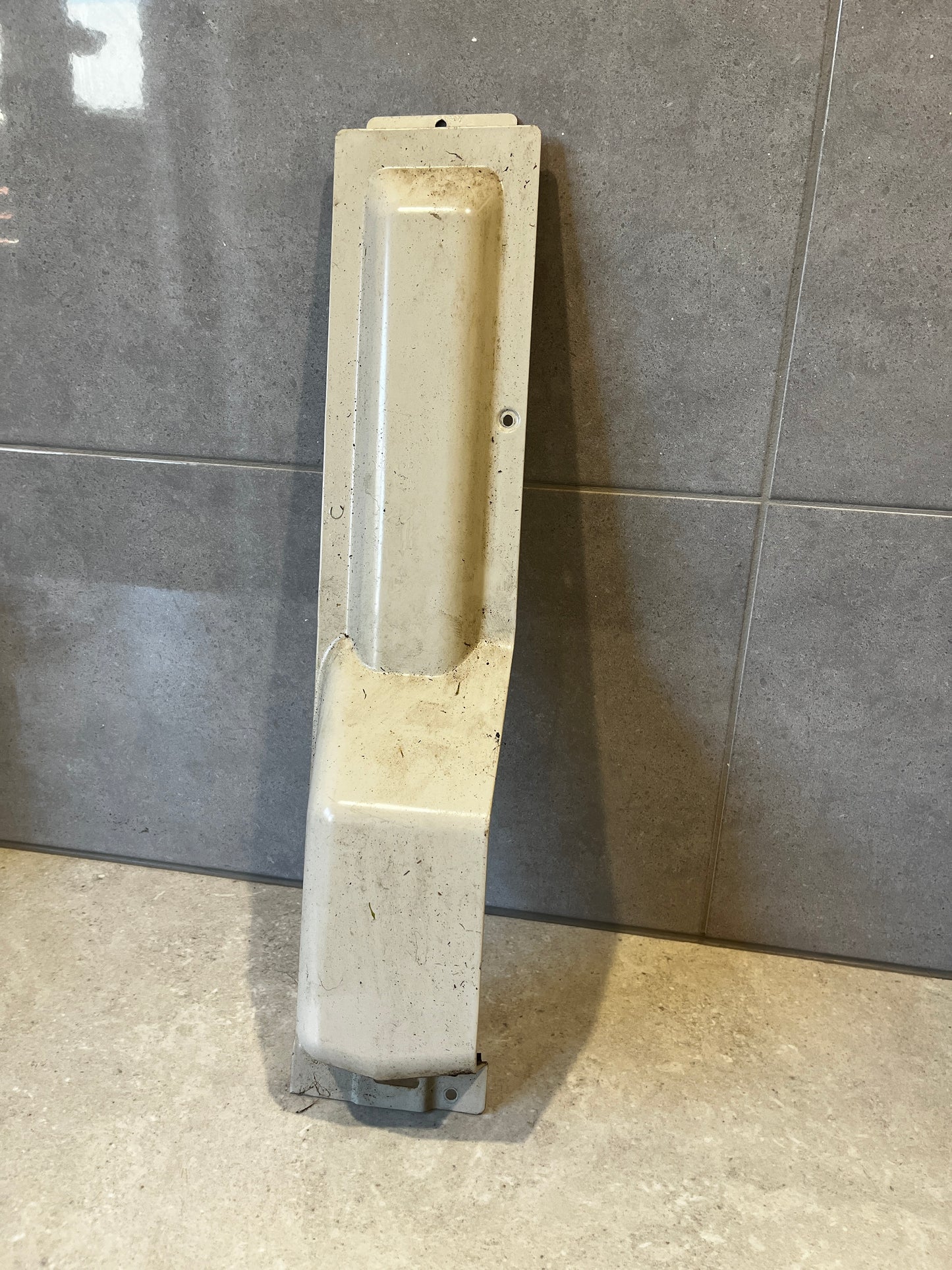 Heavy-duty cream-colored metal guard panel with mounting holes