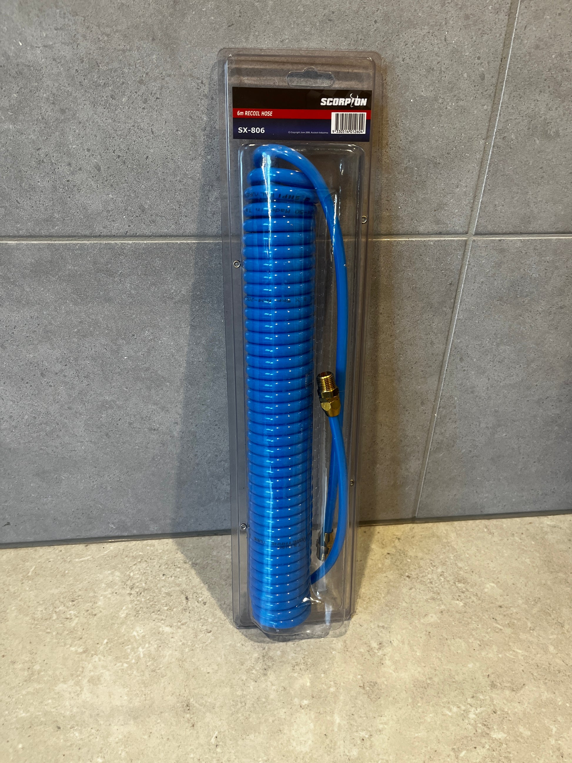 6m blue recoil air hose coiled in clear blister packaging, labeled SX-806 by Scorpion