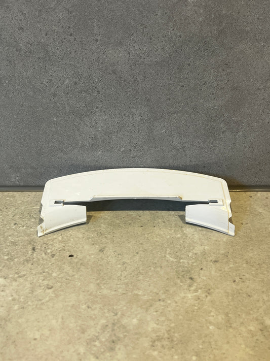 White curved ABS plastic appliance cover on a stone surface