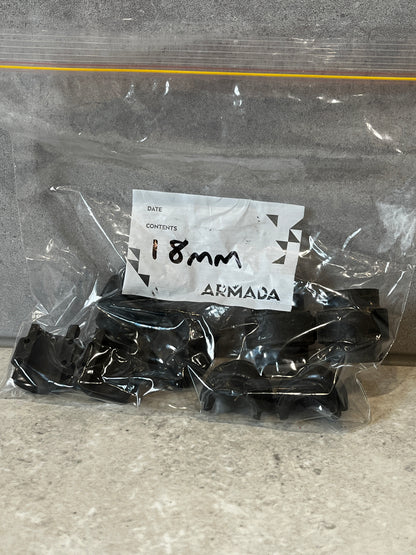 Bag containing multiple Armada 18mm black plastic bearing mounts