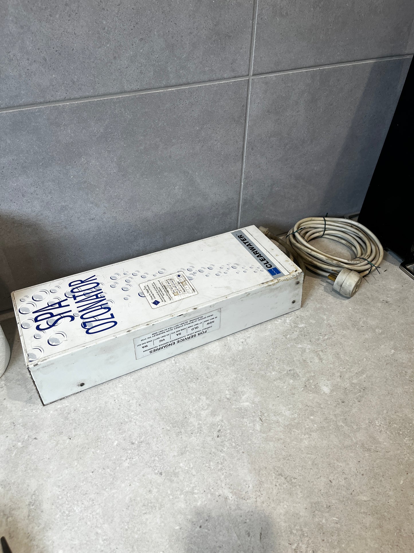 Clearwater spa ozonator device with cable on tile countertop