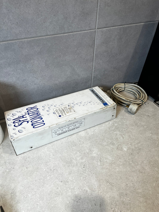 Clearwater spa ozonator device with cable on tile countertop