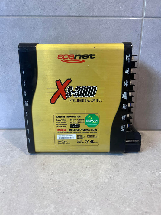 Front view of SpaNet XS-3000 Intelligent Spa Controller showing labeling and sockets