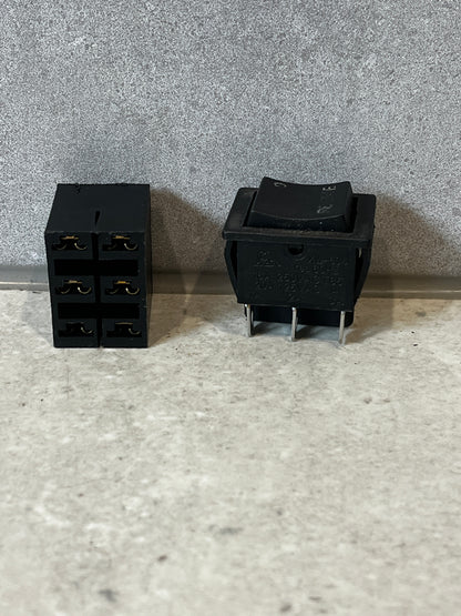 Dual view of heavy duty rocker switch with connector base