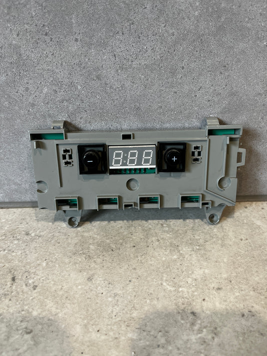Front view of digital oven control board with LED display and buttons