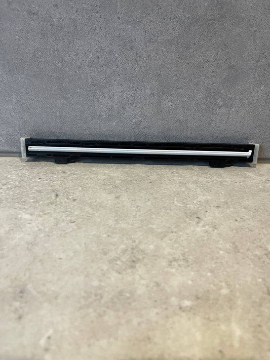 Front view of a thermal printer printhead with black plastic casing and white heating element strip