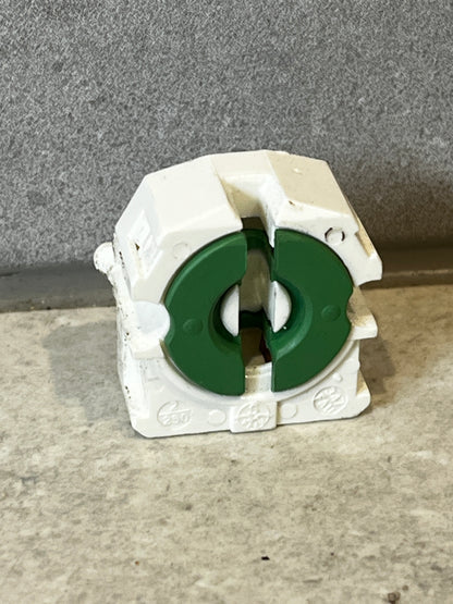 Front view of fluorescent lamp holder socket with green inserts