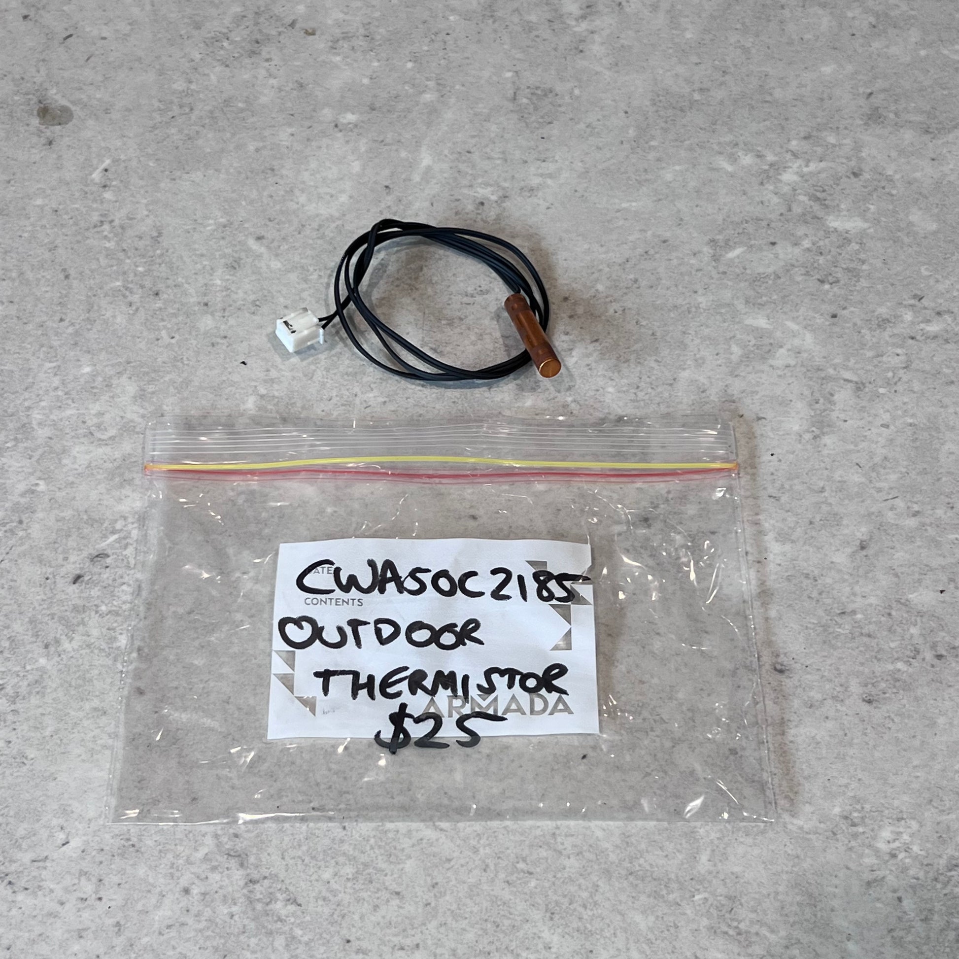 Outdoor thermistor with copper probe and connector, shown above labeled bag