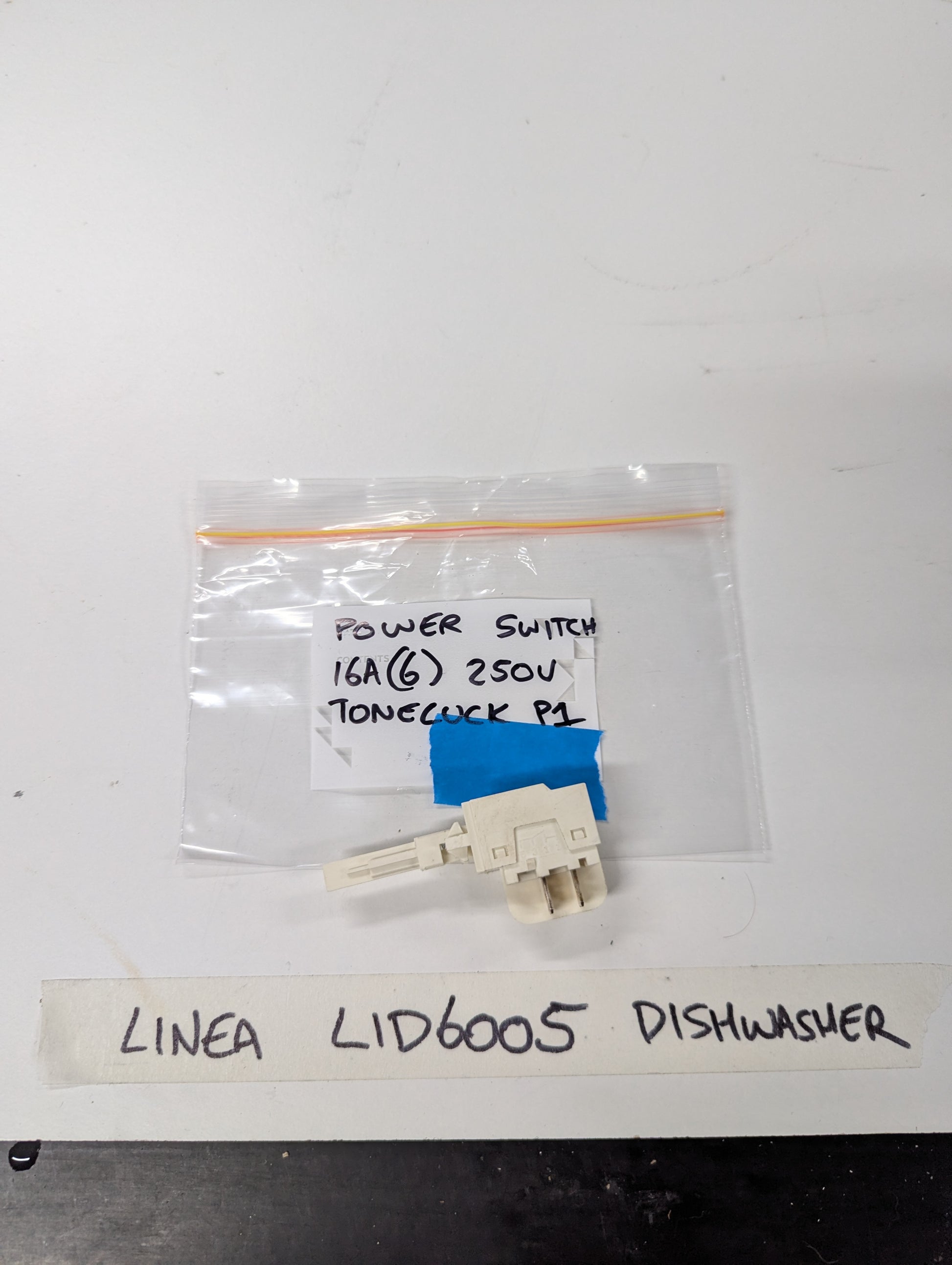 Linea LID6005 dishwasher power switch replacement photographed on a white surface