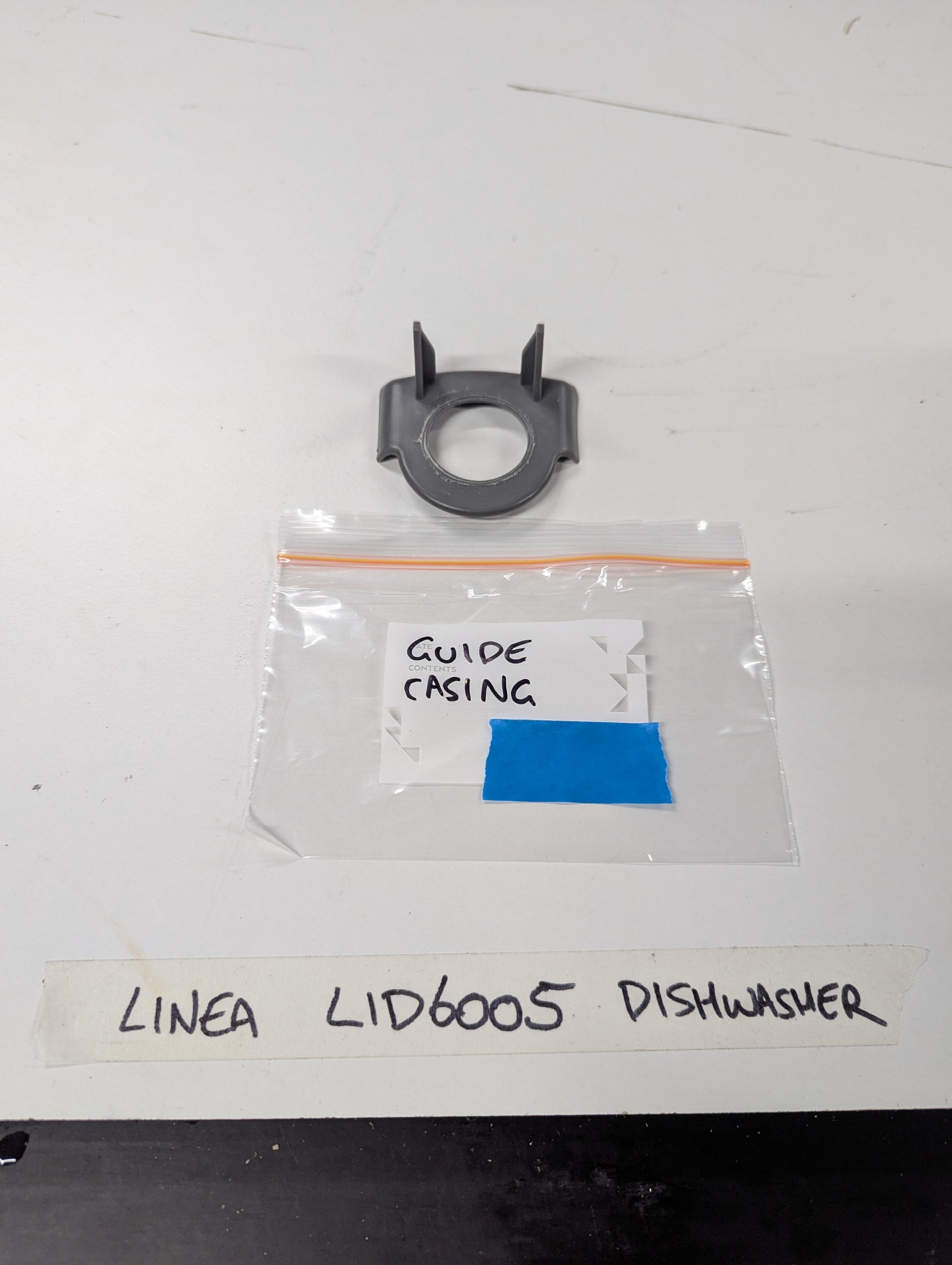 Linea LID6005 dishwasher guide casing replacement part in gray plastic with labeled packaging