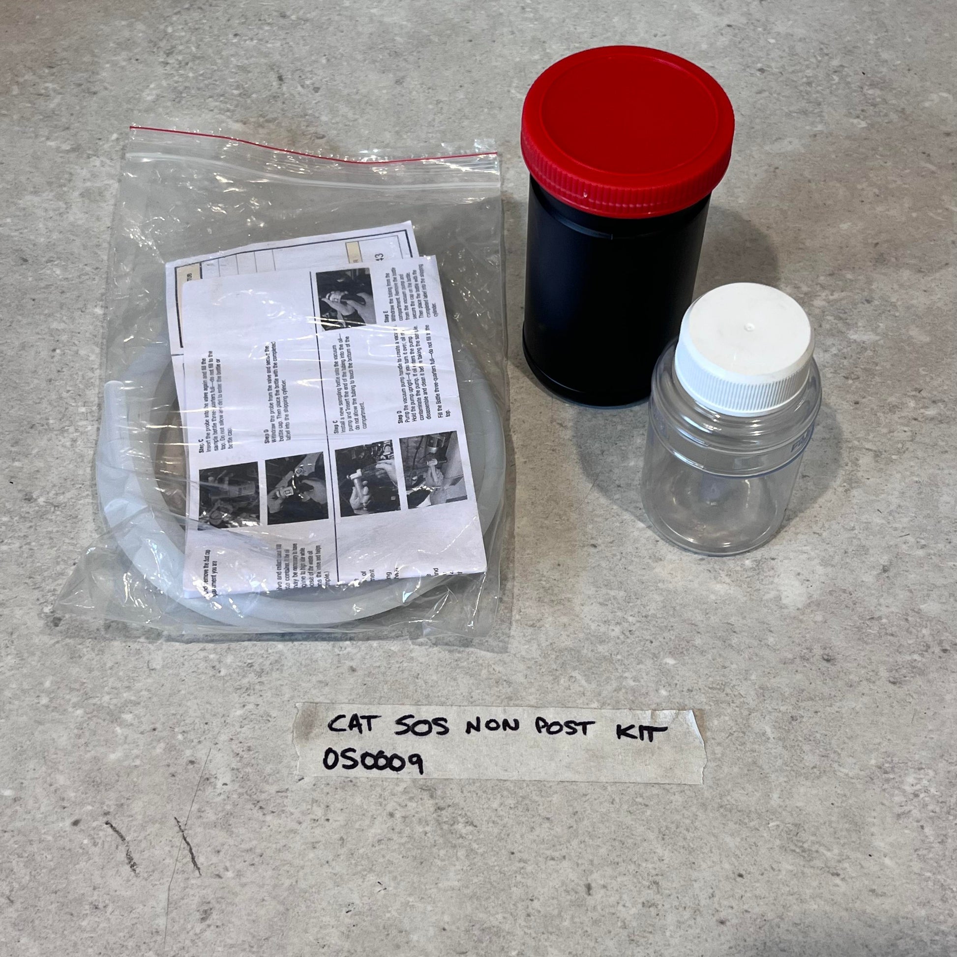 CAT 505 Non Post Kit with containers, tubing, and instructions on a countertop