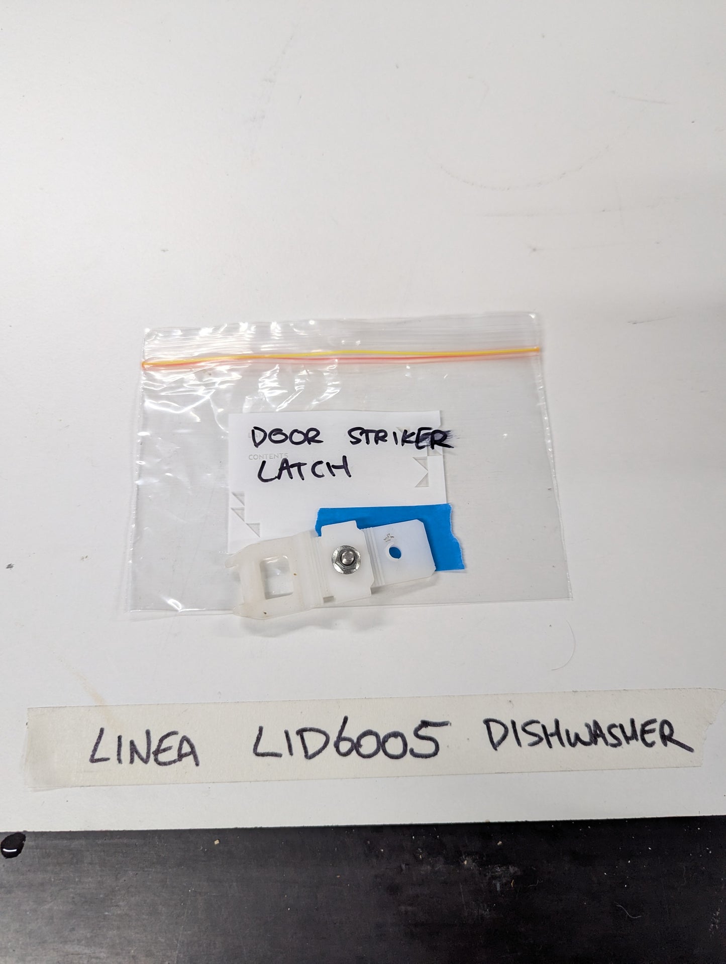 Linea LID6005 dishwasher door striker latch replacement part in clear plastic bag
