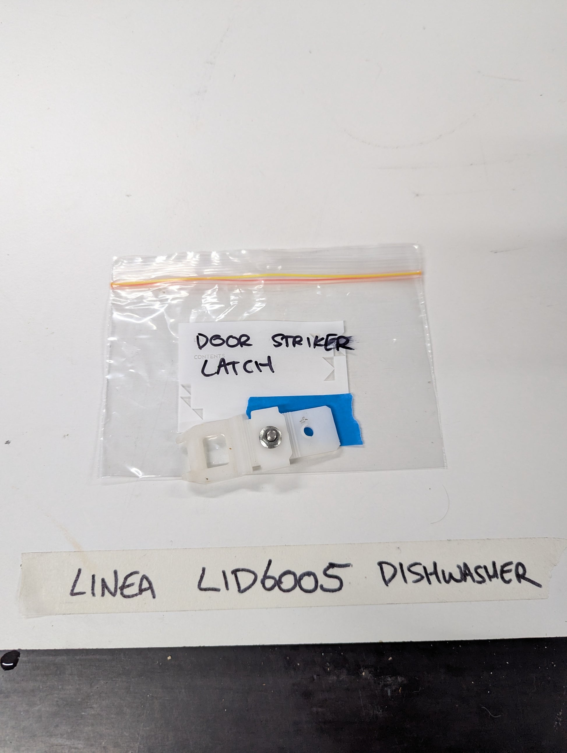 Linea LID6005 dishwasher door striker latch replacement part in clear plastic bag