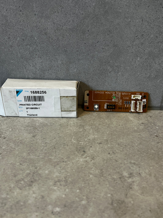 Daikin printed circuit board with labeled box on gray surface