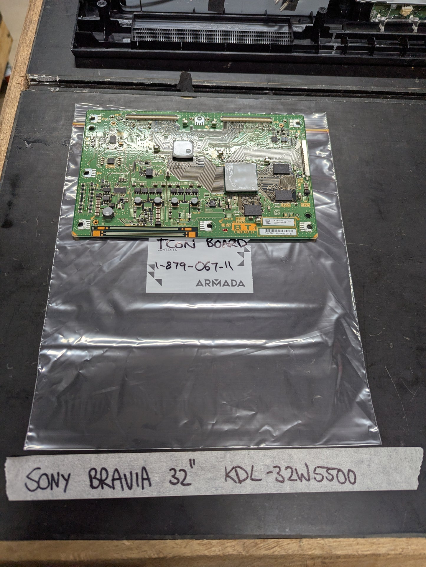 Sony Bravia 32-inch KDL-32W5500 TCON board with part number 1-879-067-11 on anti-static bag