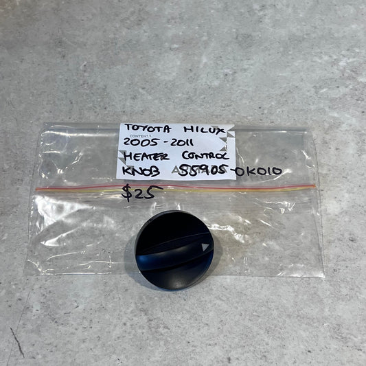 Toyota Hilux 2005-2011 heater control knob with labeled bag on gray surface