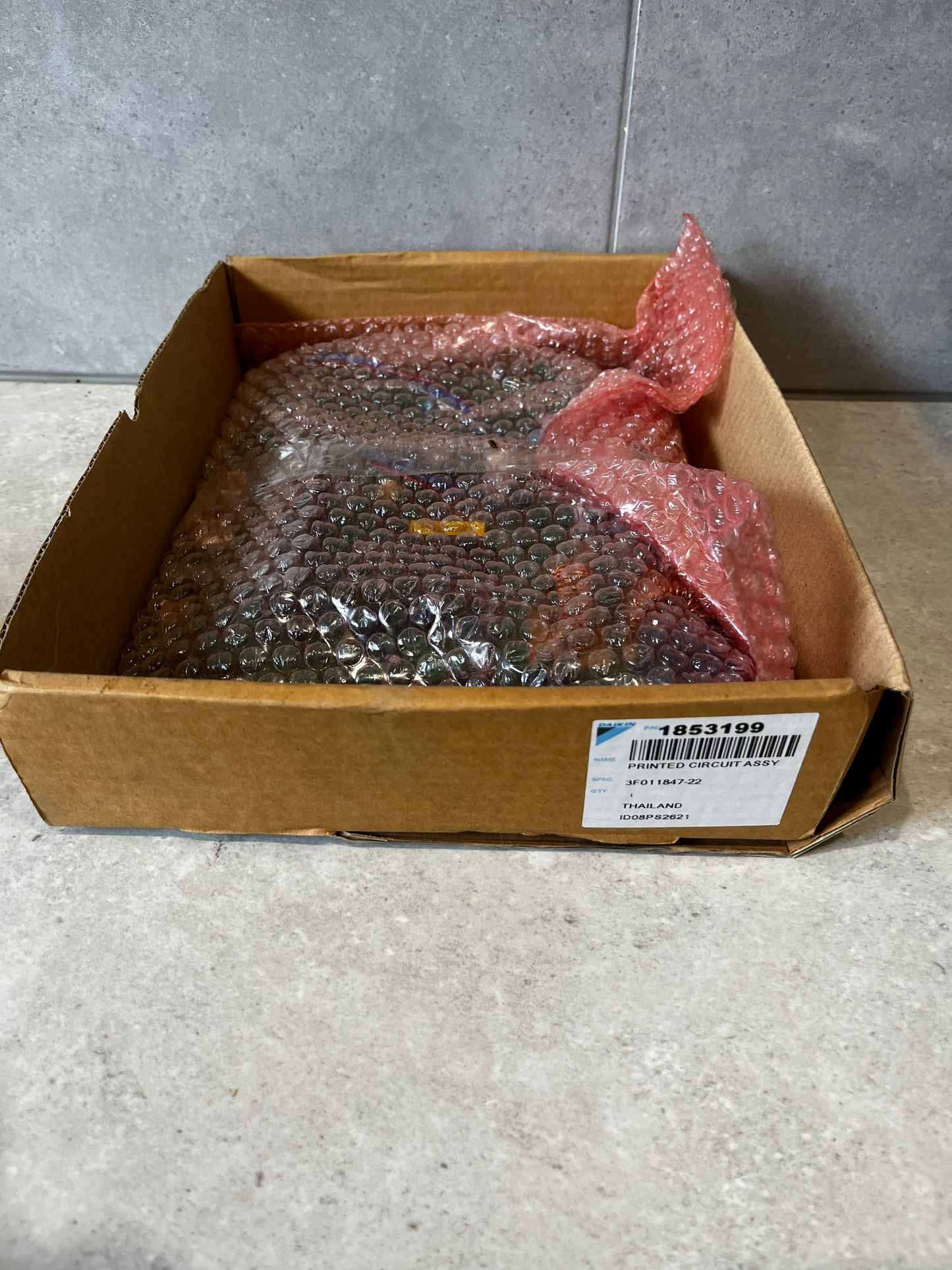 Printed circuit board assembly packaged in box with bubble wrap