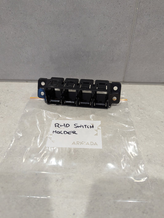 Armada RHD switch holder panel with mounting holes and plastic packaging labeled RHD Switch Holder