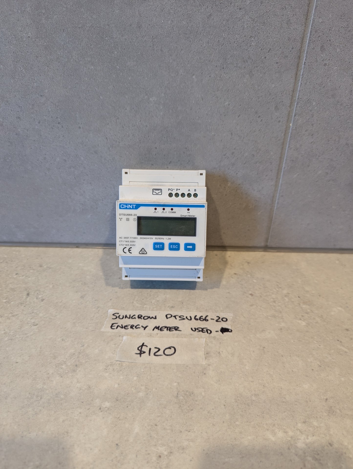 Used Sungrow DTSU666-20 energy meter by Chint on a countertop with $120 price tag