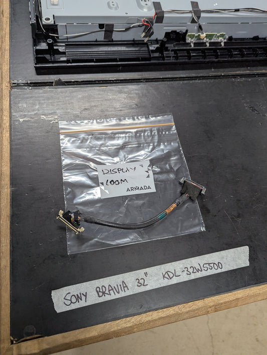 Sony Bravia KDL-32W5500 display cable in plastic bag on workbench