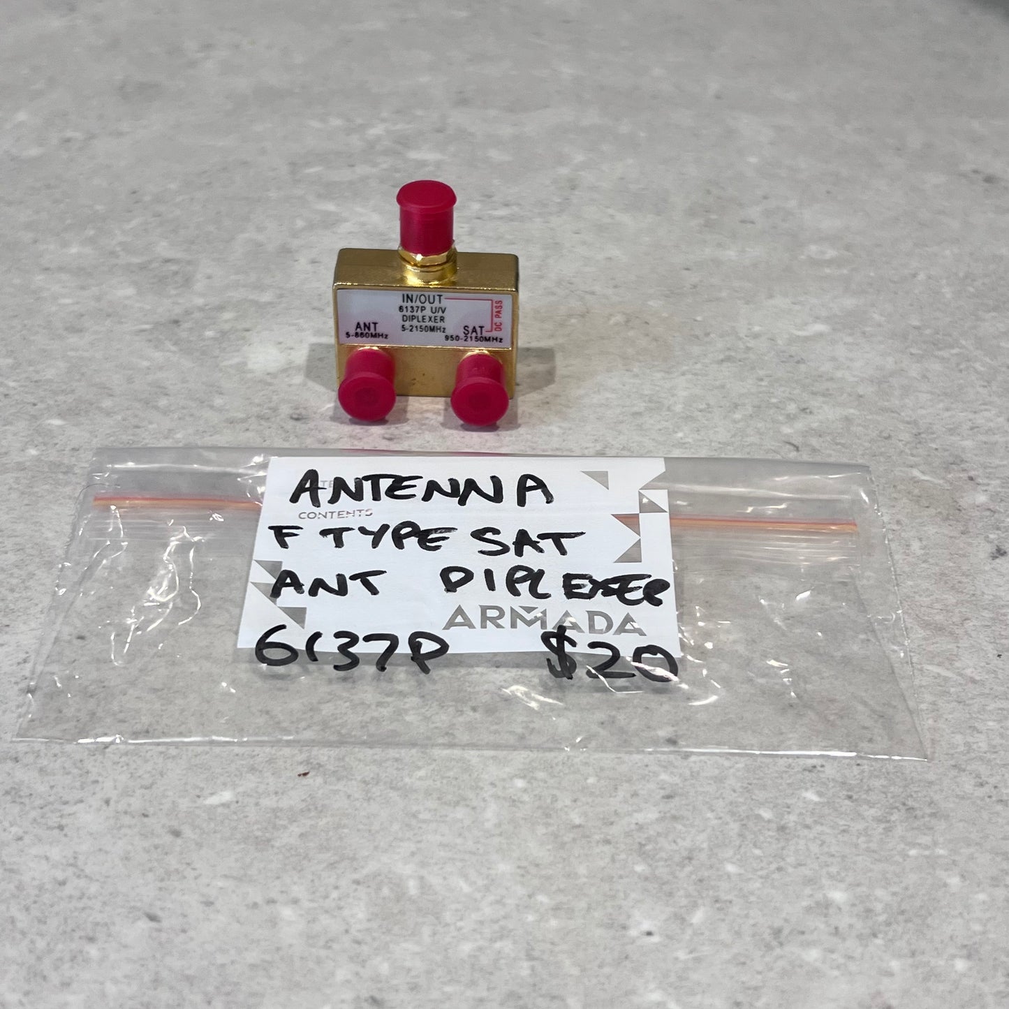 F Type SAT Antenna Diplexer with red protective caps and labeled bag on gray surface