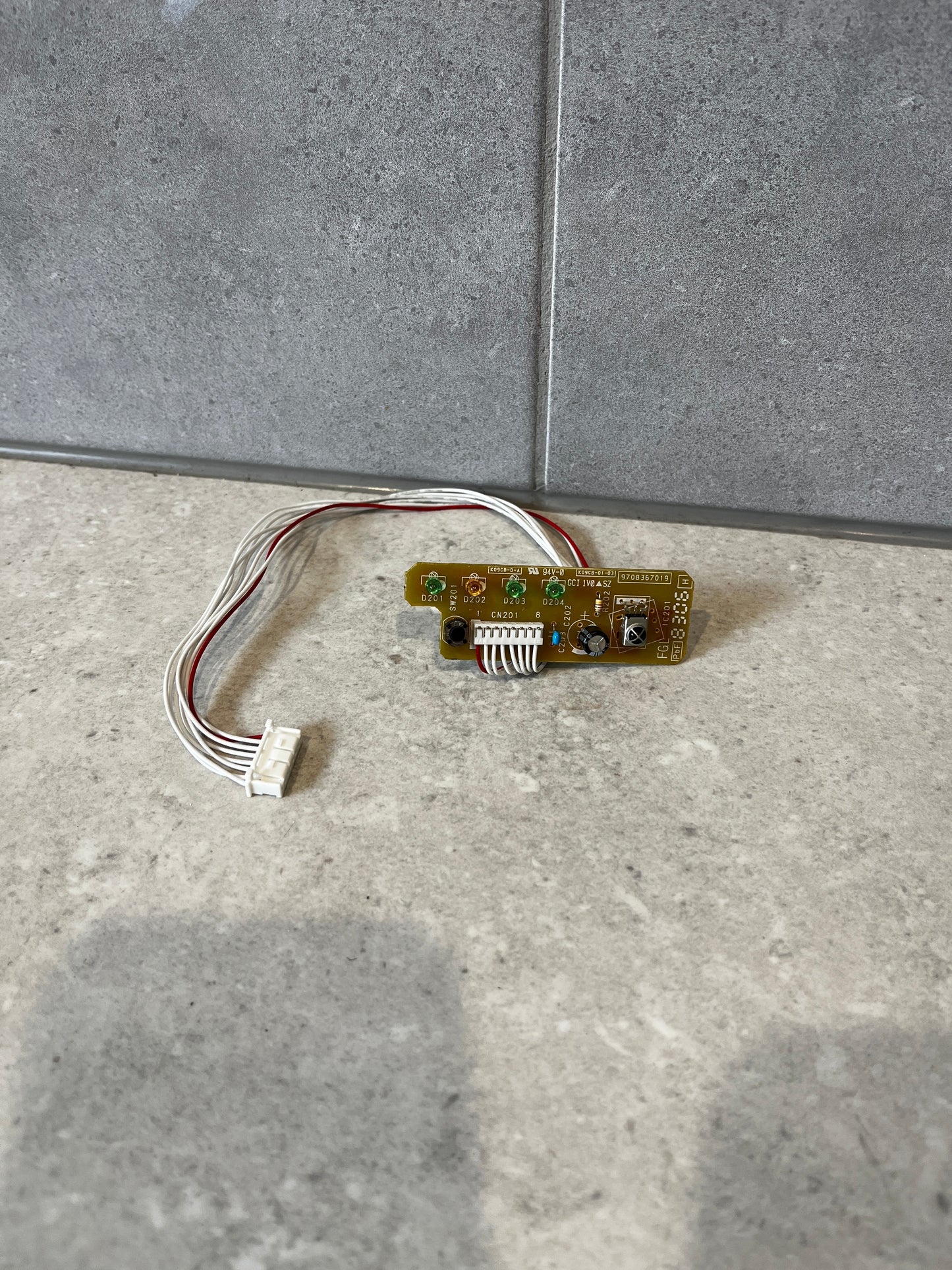 Electronic control circuit board module with wire harness on stone surface