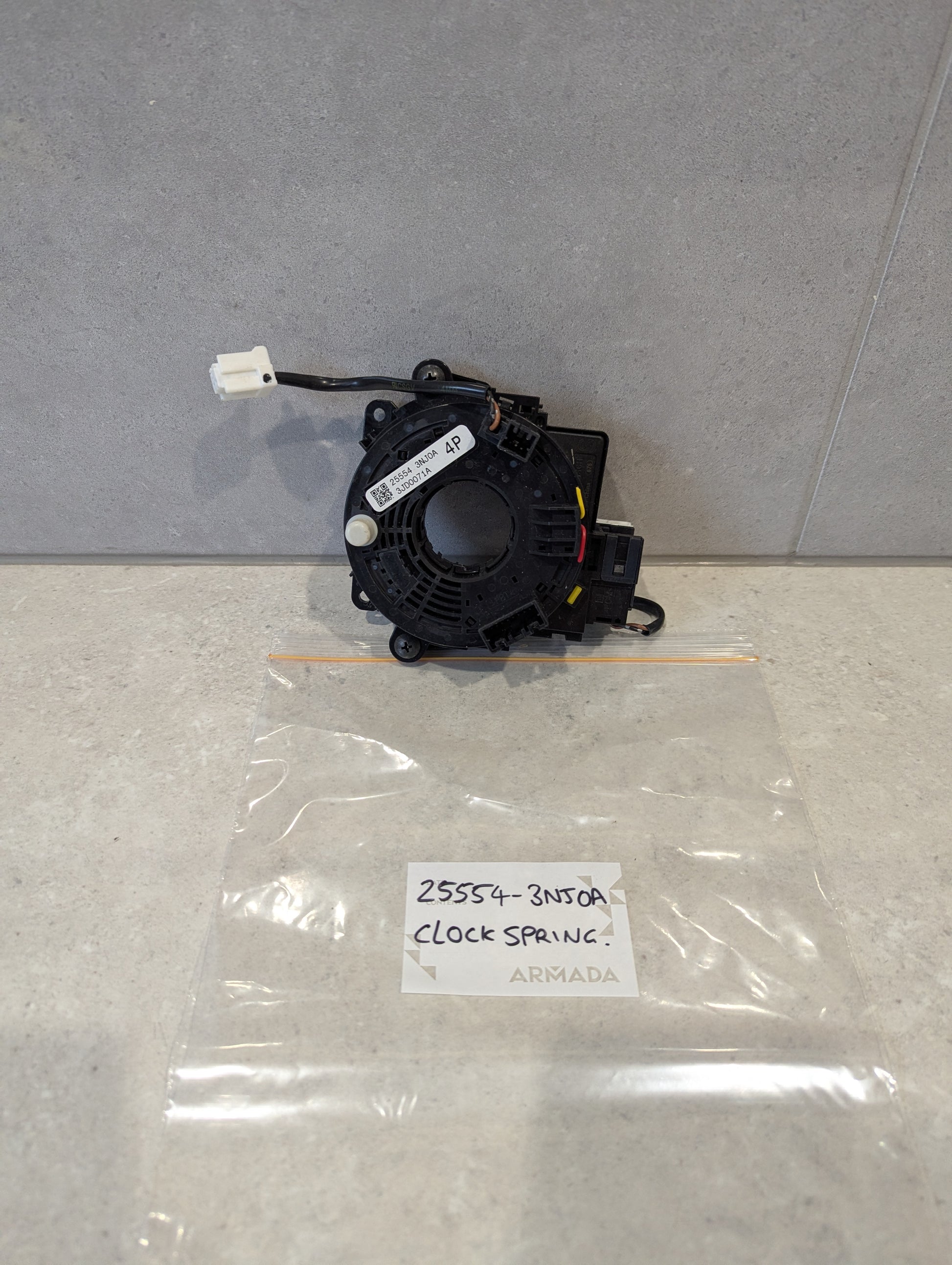 Front view of Nissan clock spring with part number 25554-3N50A visible