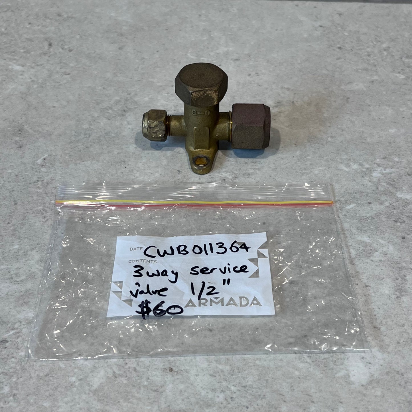 Top view of 3-way brass service valve with labeled bag