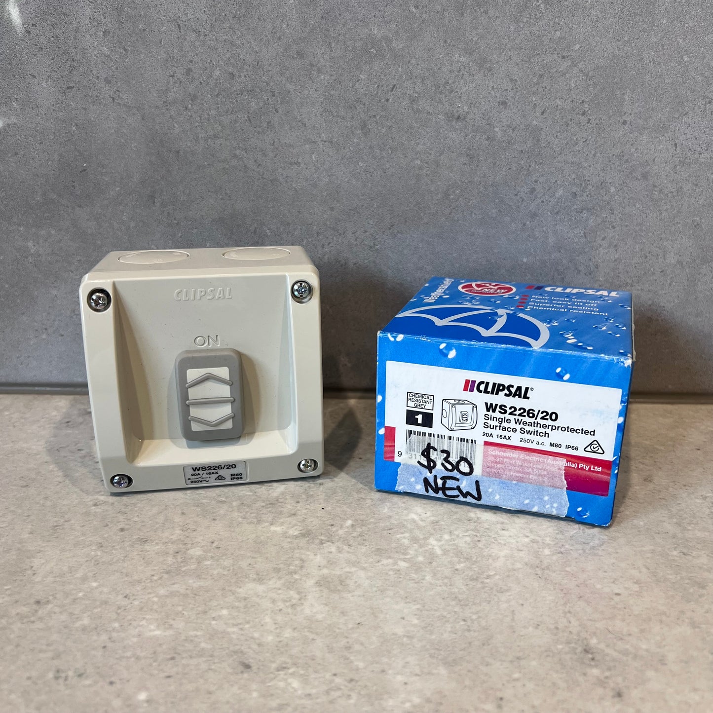 Clipsal WS226/20 weatherprotected surface switch with original box on a countertop