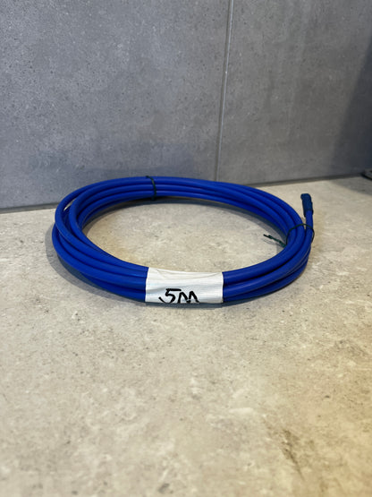 Coiled blue 3M purification tubing on a countertop with label marked '5m'.