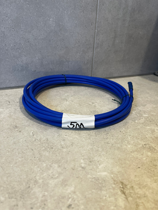 Coiled blue 3M purification tubing on a countertop with label marked '5m'.
