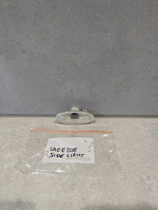 SAEE208 side light replacement lens and labeled plastic bag on a countertop