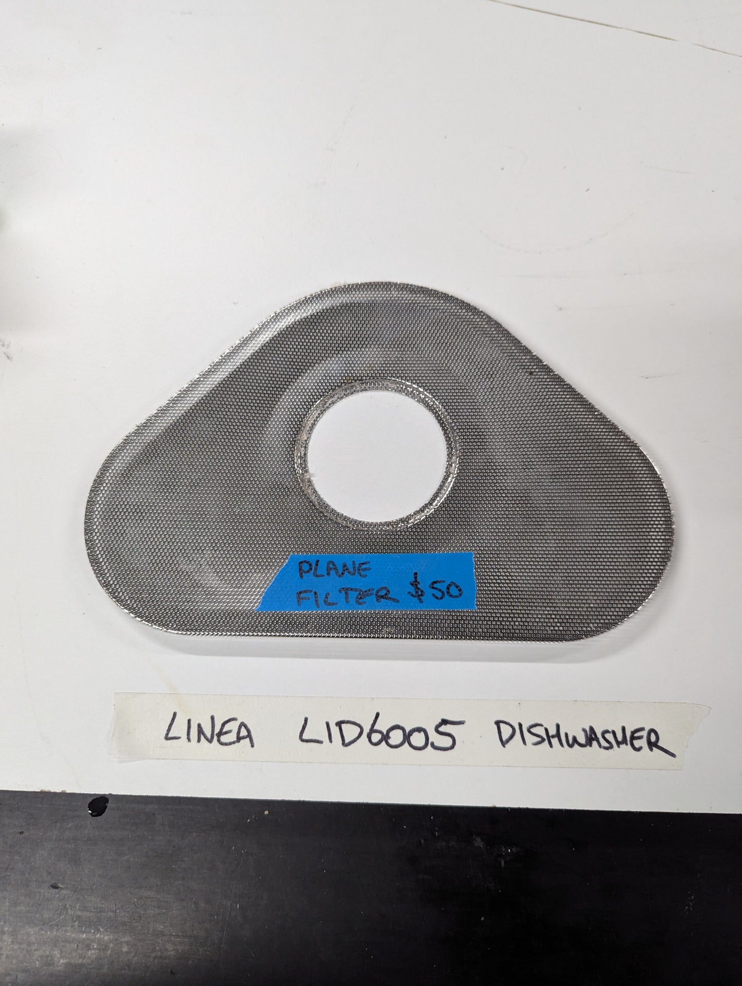 Linea LID6005 dishwasher stainless steel mesh filter on white surface
