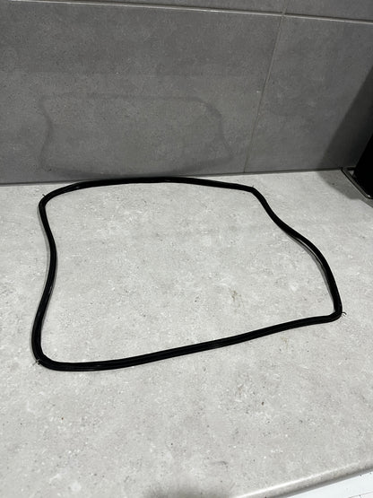 Black rubber window seal gasket laid out on a light countertop
