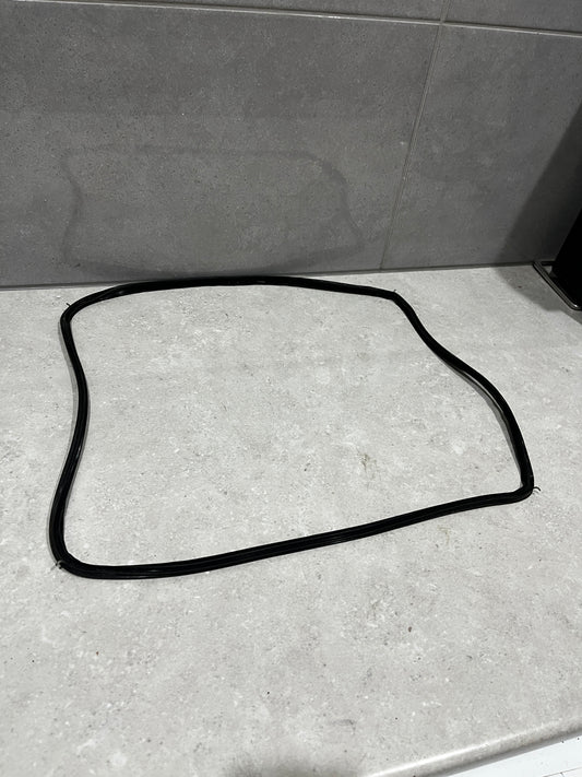 Black rubber window seal gasket laid out on a light countertop