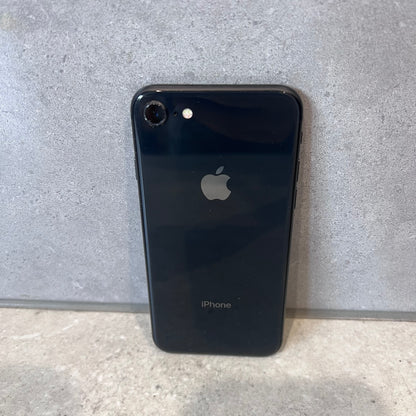Back view of black Apple iPhone 8 with Apple logo and single camera