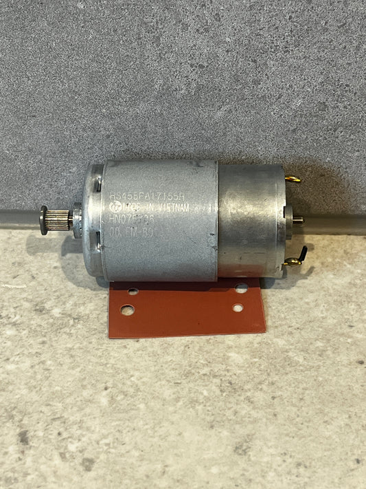 DC electric motor with metal housing and gear shaft