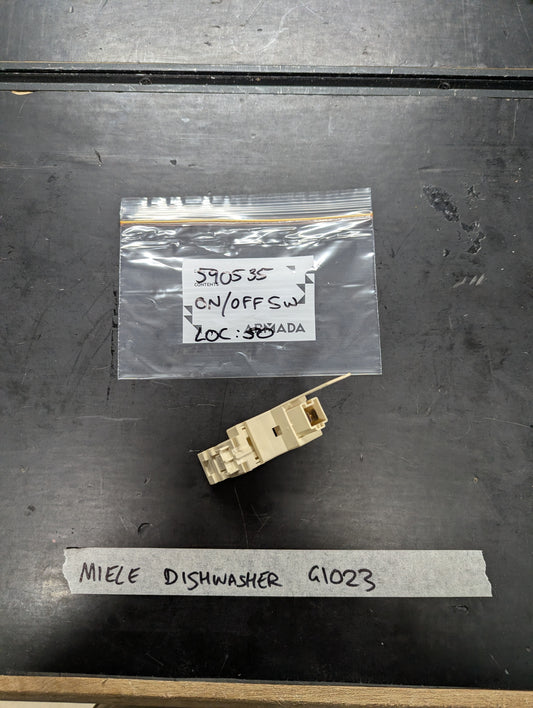 Miele G1023 dishwasher on off switch replacement part on black surface