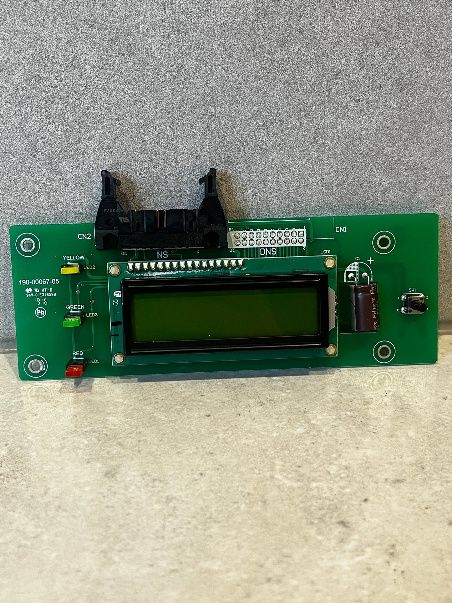 LCD display circuit board module with LED indicators and socket on green PCB