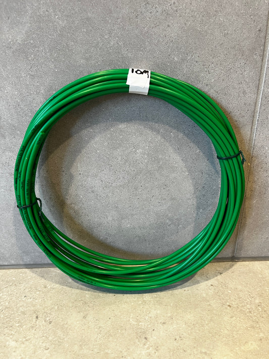 Green polyethylene wire coil neatly coiled with white label