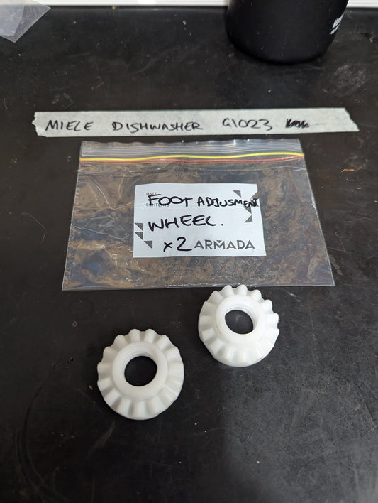 Pair of white plastic foot adjustment wheels for Miele dishwasher with labeled plastic bag