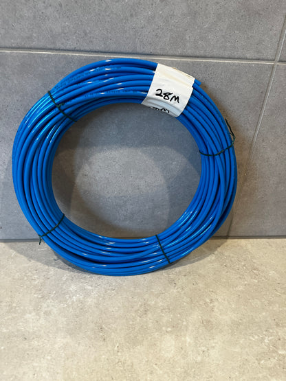 Coil of blue polyurethane tubing neatly coiled with a white label showing 28 meters length
