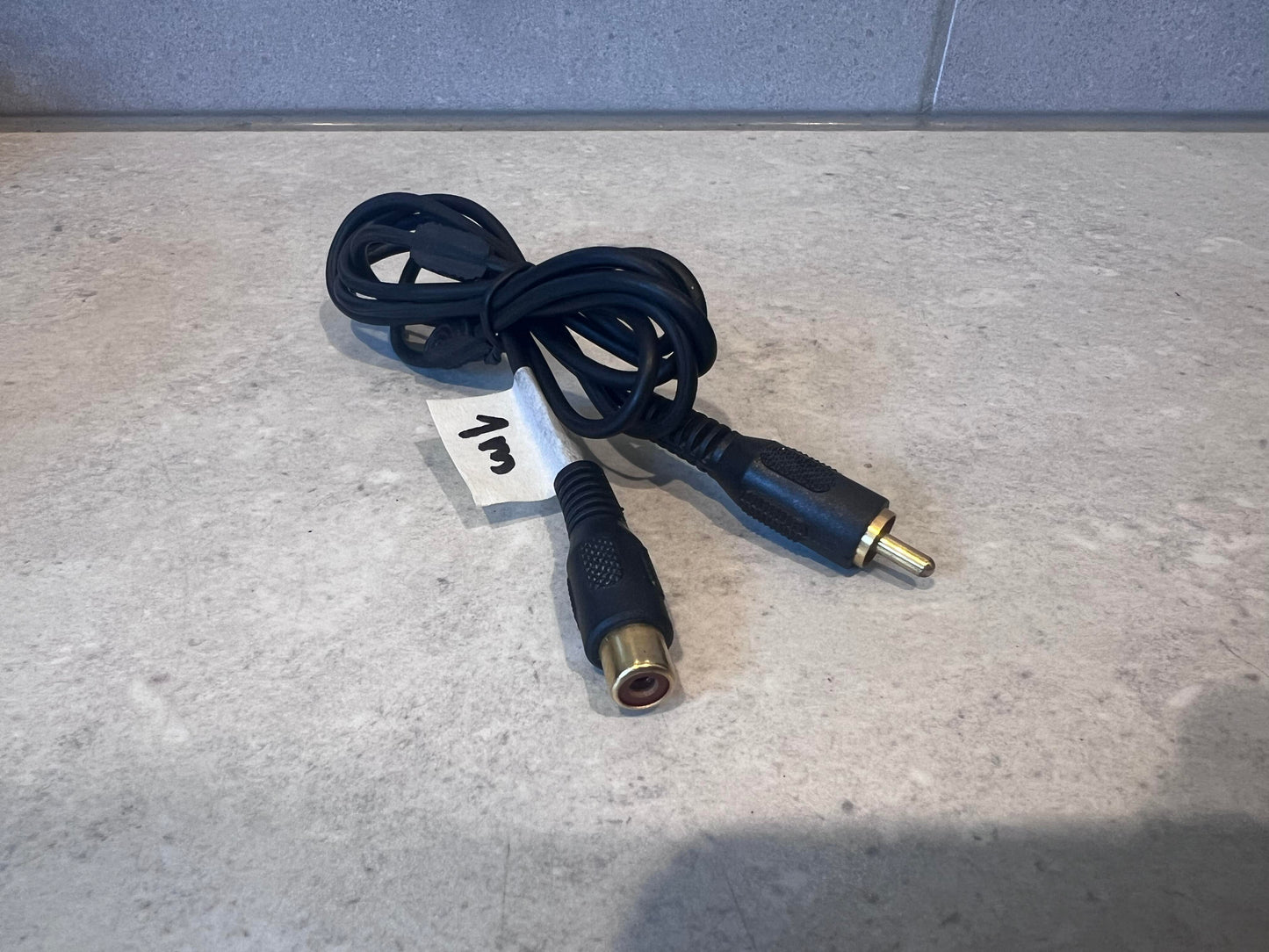 RCA male to female extension cable with black insulation and gold-plated connectors