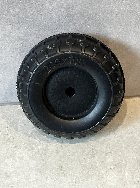 200x100 solid black rubber replacement wheel on gray surface